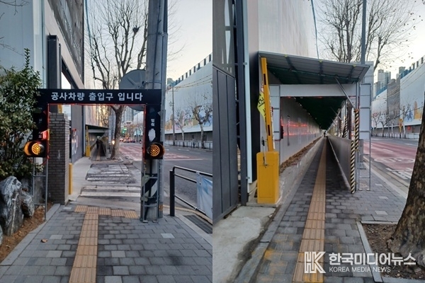 <strong>타 건설사 공사현장 진입로에 차단 시설과 바로 옆의 인도에 천장이 있는 보행자 통로</strong>